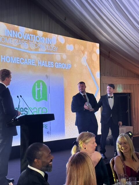 Hales Group accepting the Innovation in Home Care Technology award on stage at the Leaders in Care Awards 2026