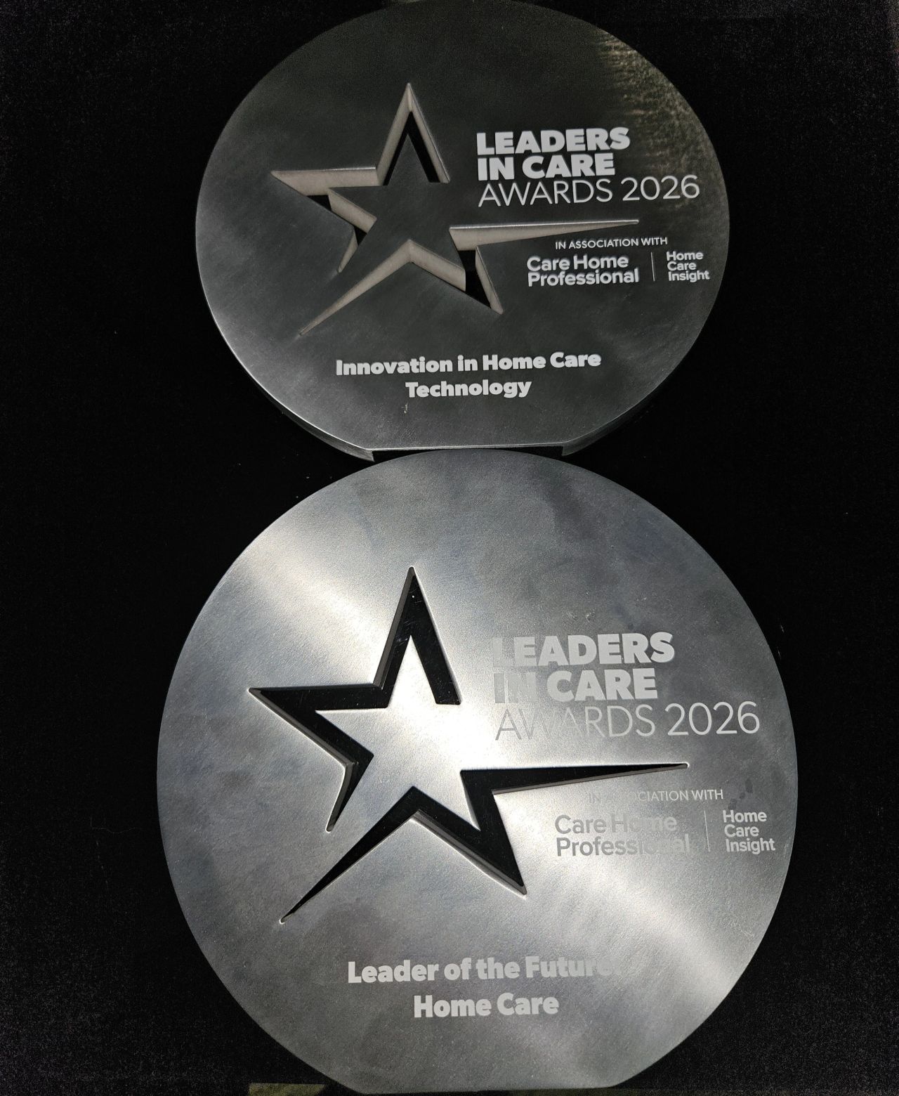 The two Leaders in Care Awards 2026 trophies won by Hales Group