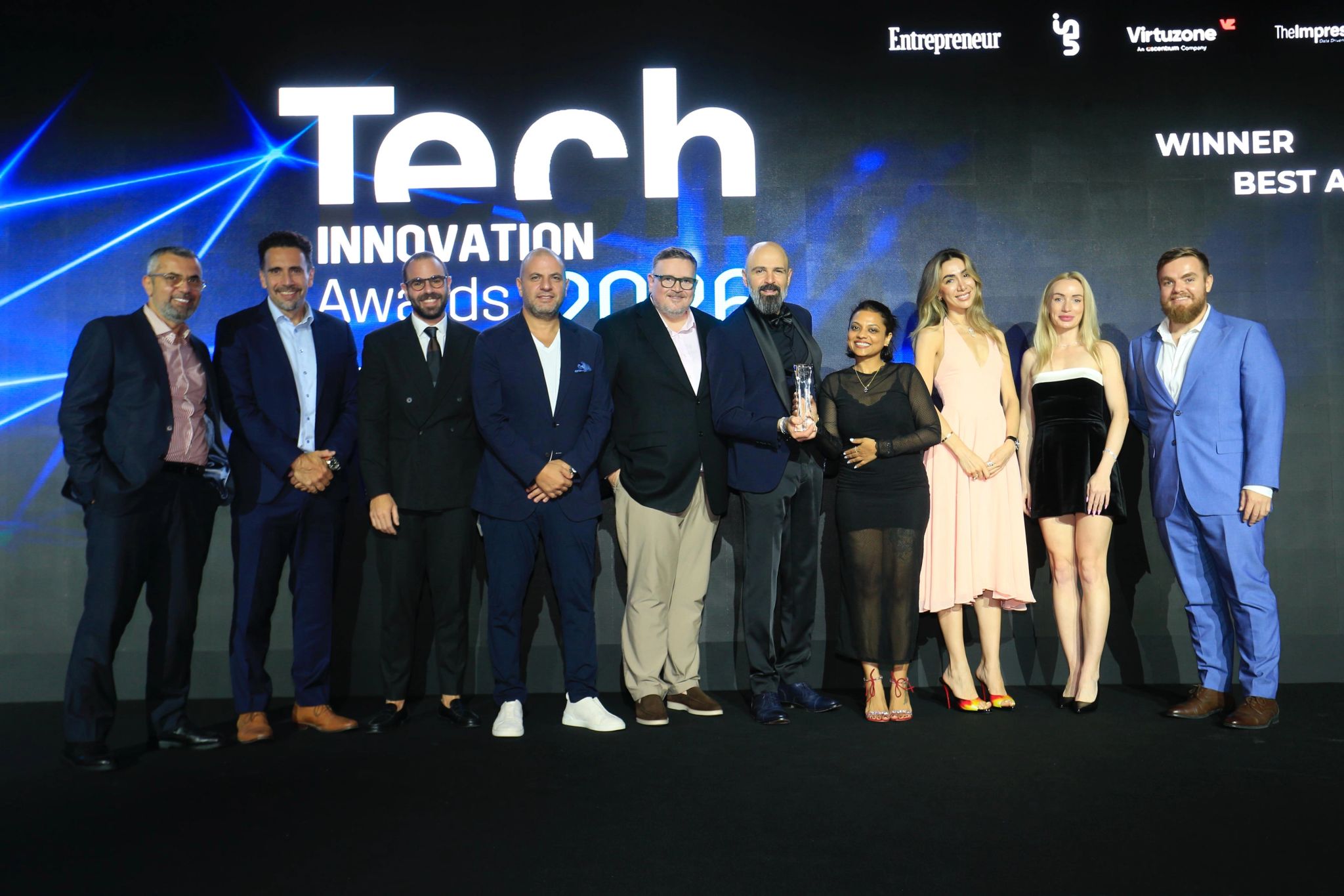 Virtuzone receiving the Best AI-Powered Corporate Services Provider award on stage at the Tech Innovation Awards 2026 in Dubai